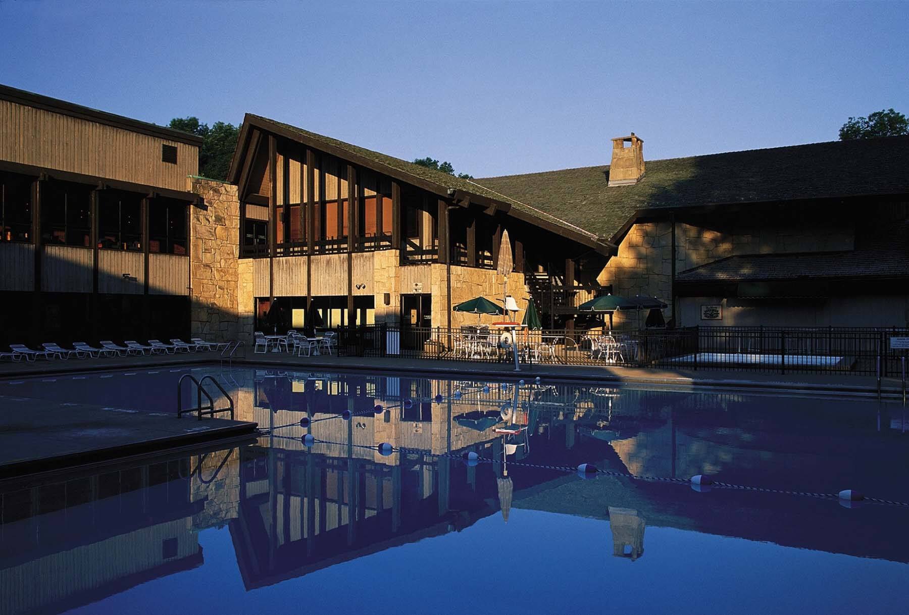 Mohican Lodge at sunset with a view of the outdoor pool