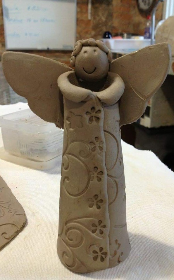 Handmade clay angel vase.