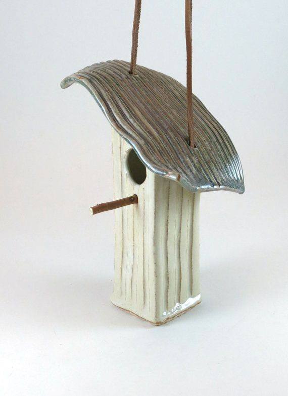 Glazed ceramic bird house.